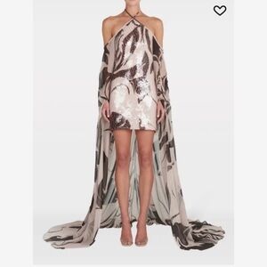 Silvia Tcherassi Kavya Dress

Elegant Sequin Halter Dress with Cape
Fits a 4/6